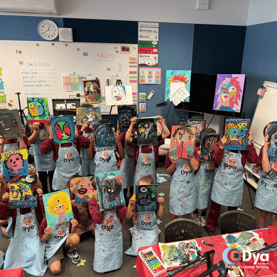 Blackburn Primary School students holding Picasso self portrait artworks during DYA Australia creative art workshop