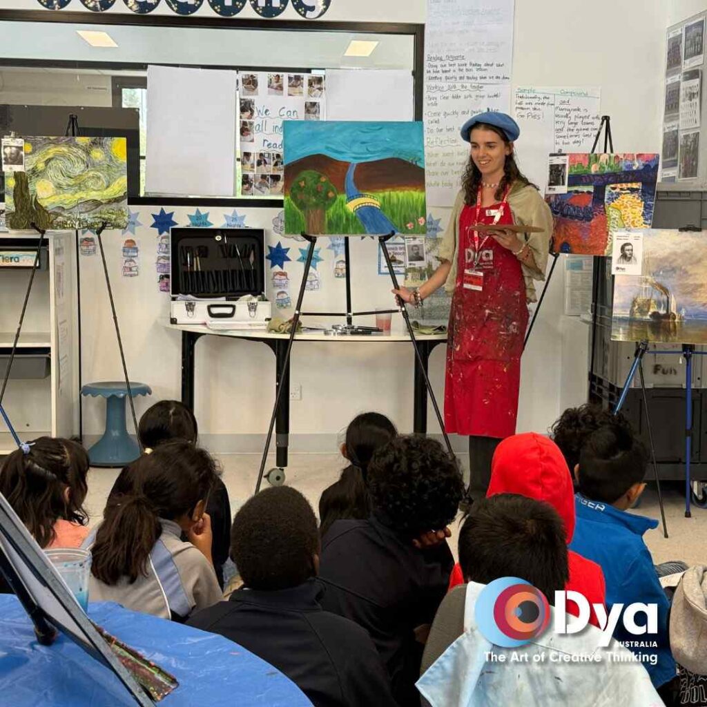 Artist leading a school art incursion with Year 3 students in a classroom setting at Davis Creek Primary School