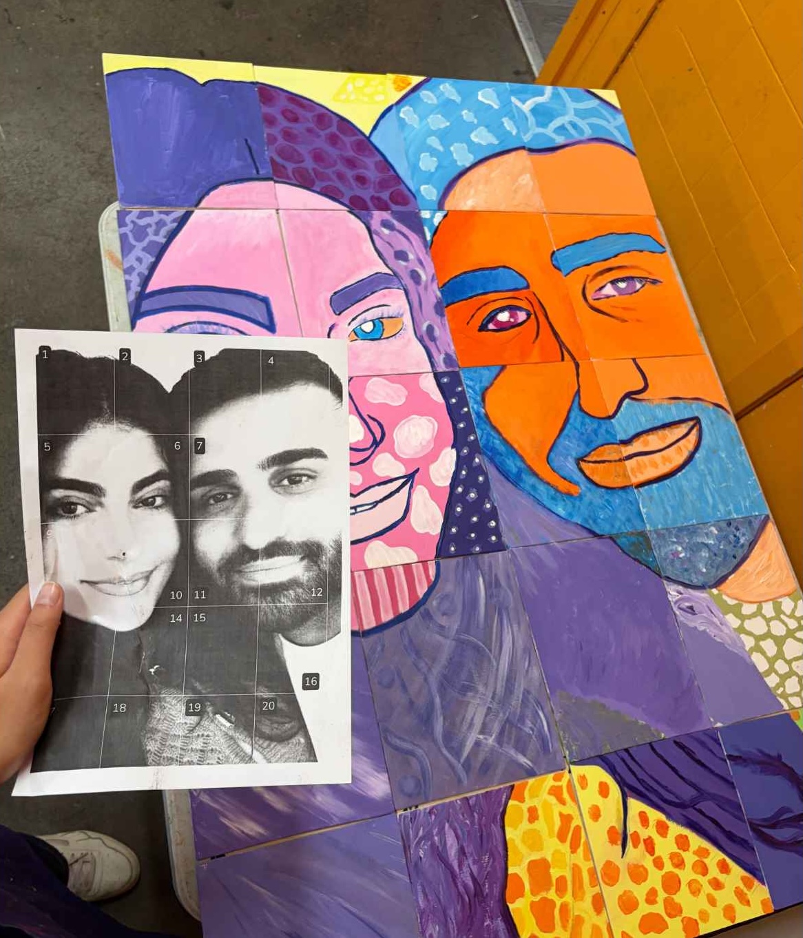 Collaborative portrait mural project painted by students